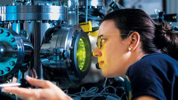 A scientist doing a measurment on a atom probe.